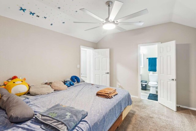 bedroom featuring carpet, ceiling fan, lofted ceiling, and ensuite bathroom