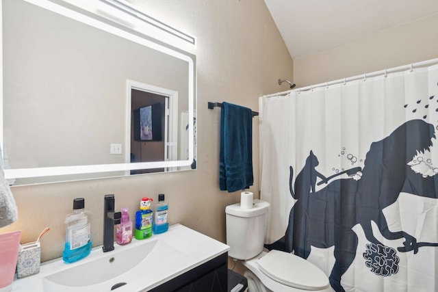 bathroom with a shower with shower curtain, vanity, toilet, and lofted ceiling