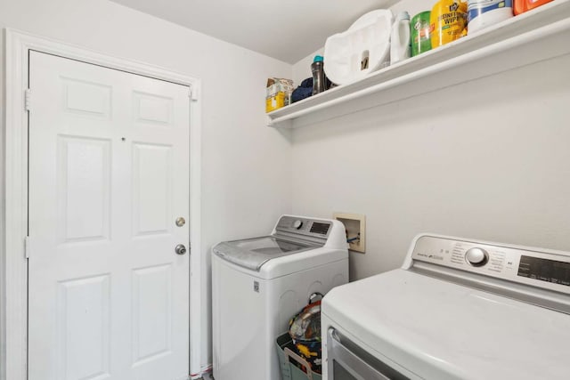 clothes washing area with washer and dryer