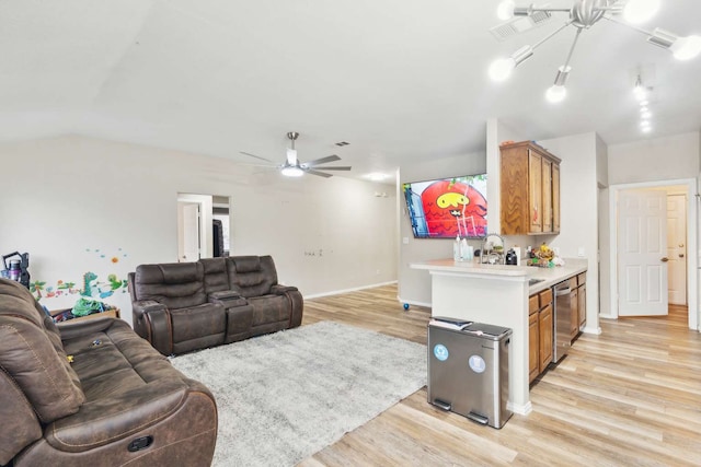 living room featuring light wood-type flooring, vaulted ceiling, and ceiling fan