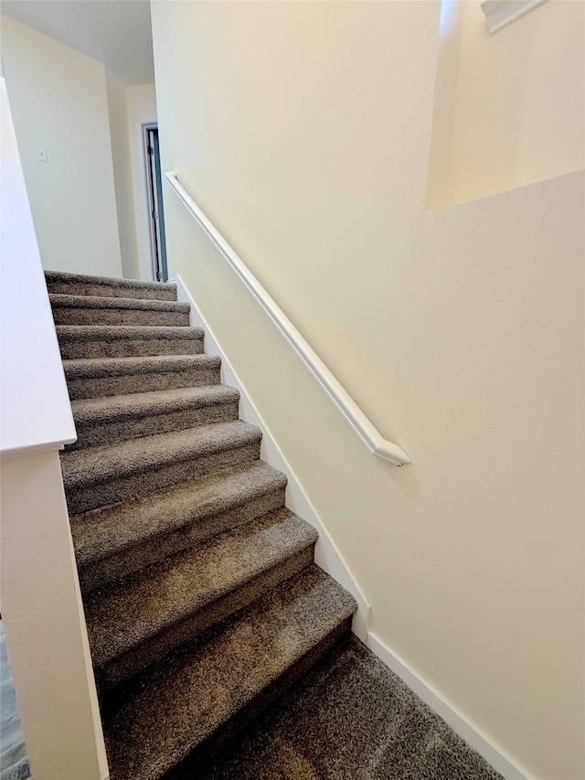 stairway with carpet floors