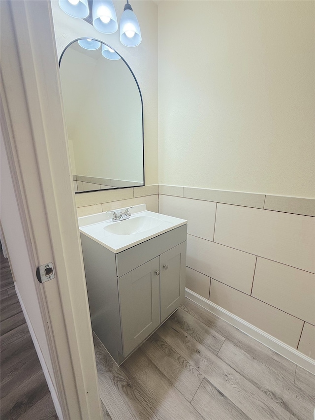 bathroom featuring hardwood / wood-style floors and vanity