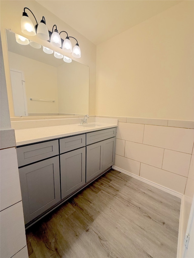 bathroom featuring hardwood / wood-style flooring and vanity