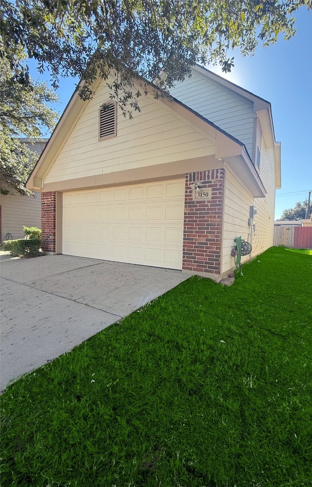 view of front of home with a garage and a front yard