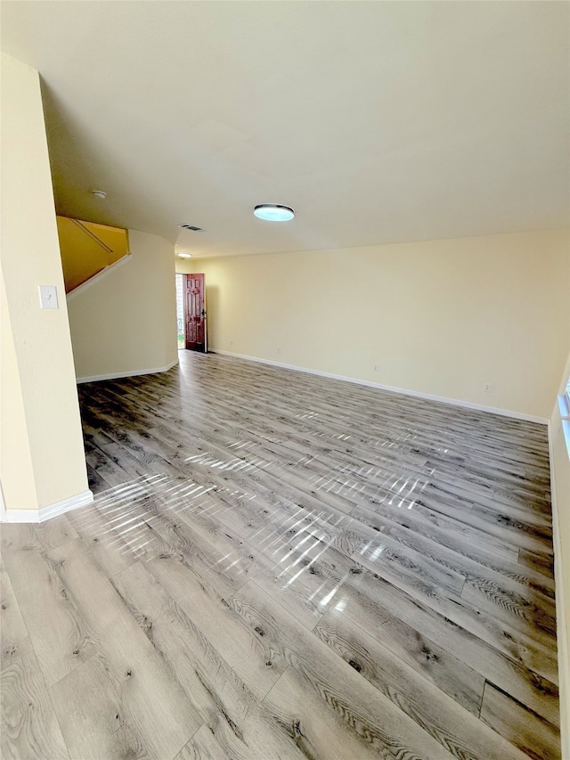 empty room featuring hardwood / wood-style flooring