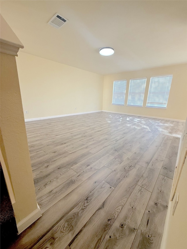 unfurnished room with light hardwood / wood-style floors