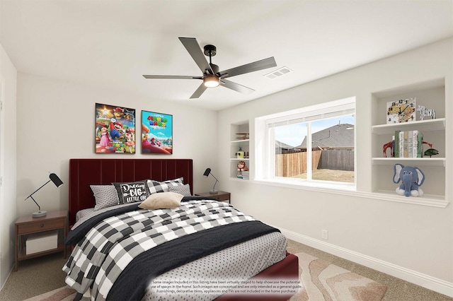 carpeted bedroom with visible vents, ceiling fan, and baseboards