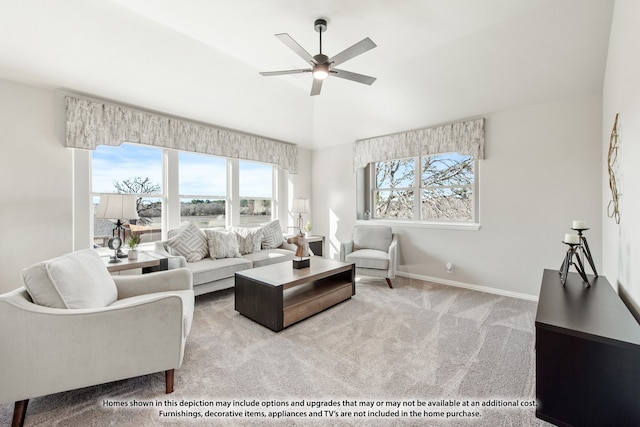 living room with light colored carpet, vaulted ceiling, and ceiling fan