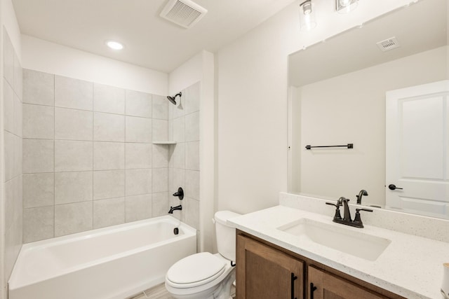 full bathroom with toilet, visible vents, shower / washtub combination, and vanity