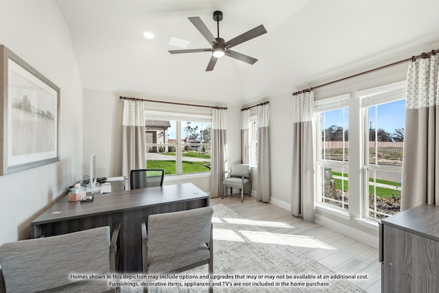 office space featuring plenty of natural light, ceiling fan, light wood-type flooring, and lofted ceiling