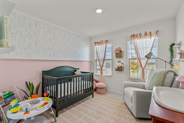 bedroom featuring a crib