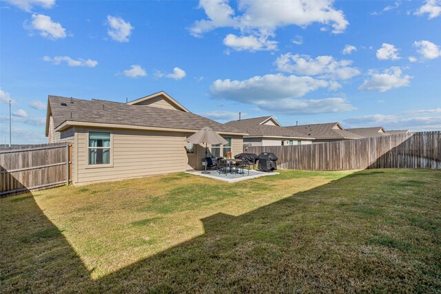 rear view of property with a patio area and a yard