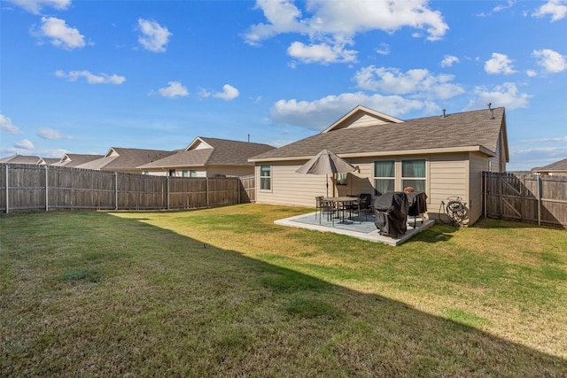 back of property featuring a patio and a yard