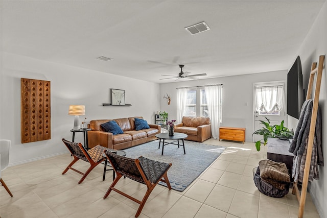 tiled living room with ceiling fan