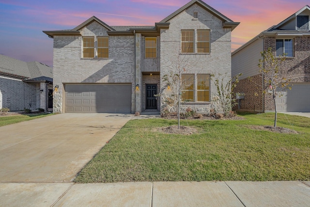 view of front facade featuring a lawn and a garage