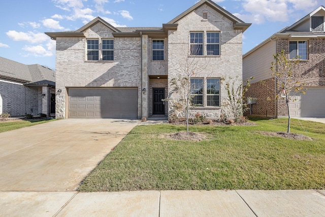 view of front of home with a front yard and a garage