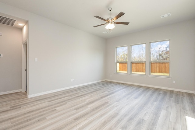 empty room featuring light wood-type flooring and ceiling fan