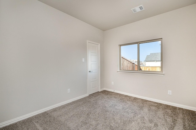 empty room with carpet flooring