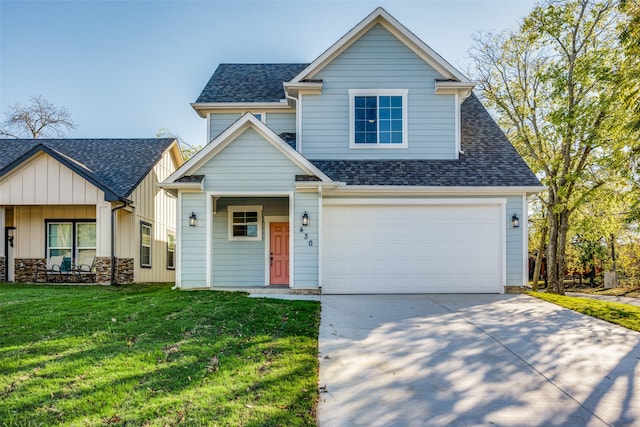 view of front of home featuring a front yard and a garage