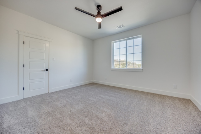 empty room with carpet floors and ceiling fan