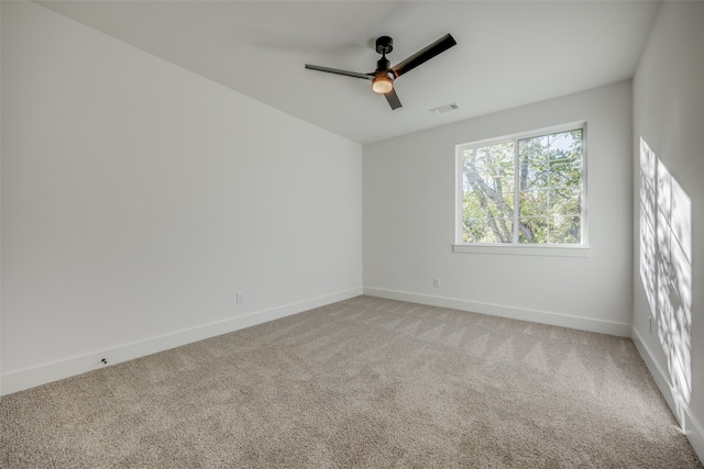 spare room with carpet floors and ceiling fan