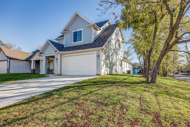 view of front of property with a front lawn and a garage