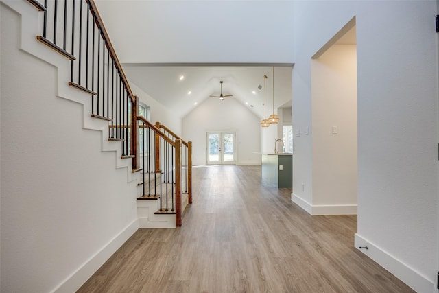 430 W Munson St, Denison, TX 75020 - foyer featuring light wood finished floors, stairs, french doors, a ceiling fan, and vaulted ceiling