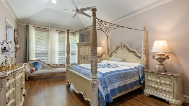 bedroom featuring ceiling fan, crown molding, dark wood-type flooring, and vaulted ceiling