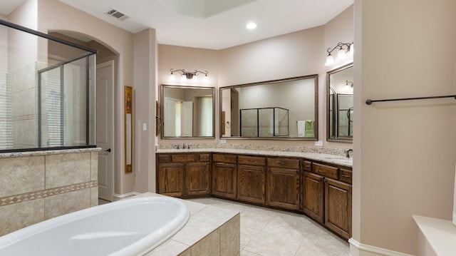 bathroom featuring tile patterned floors, vanity, and independent shower and bath