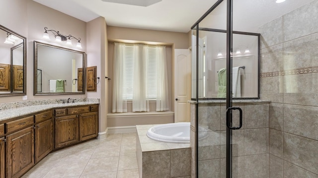 bathroom with tile patterned floors, vanity, and a shower with shower door