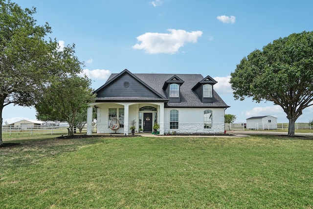 view of front of property featuring a porch and a front lawn