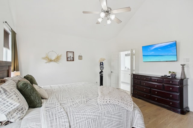 bedroom with ceiling fan, light hardwood / wood-style flooring, high vaulted ceiling, and ensuite bathroom