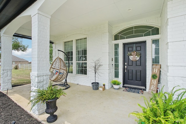 doorway to property with a porch