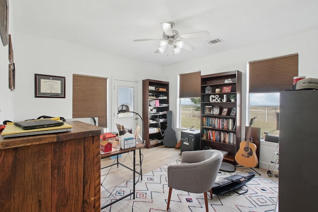 office area with ceiling fan and light wood-type flooring