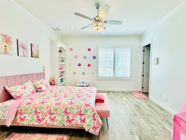 bedroom featuring ceiling fan, light hardwood / wood-style flooring, and crown molding