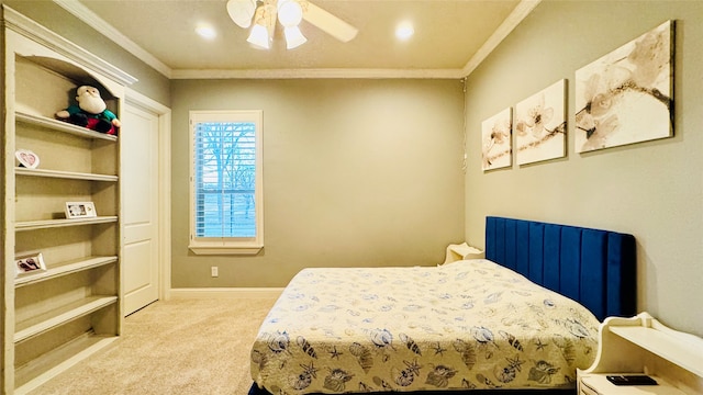 bedroom featuring ceiling fan, crown molding, and light carpet