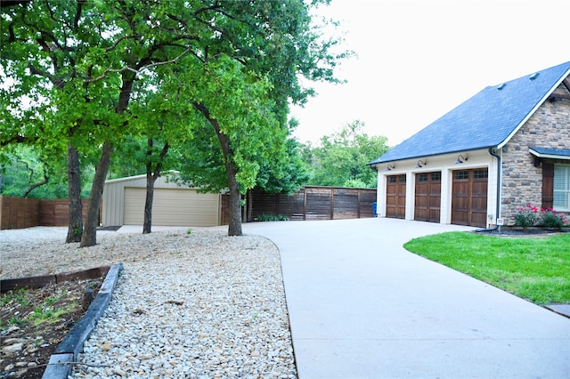 view of side of property with a garage