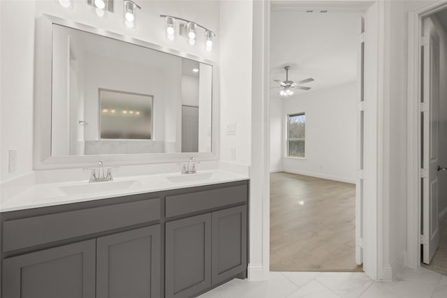 bathroom featuring a sink, double vanity, and a ceiling fan