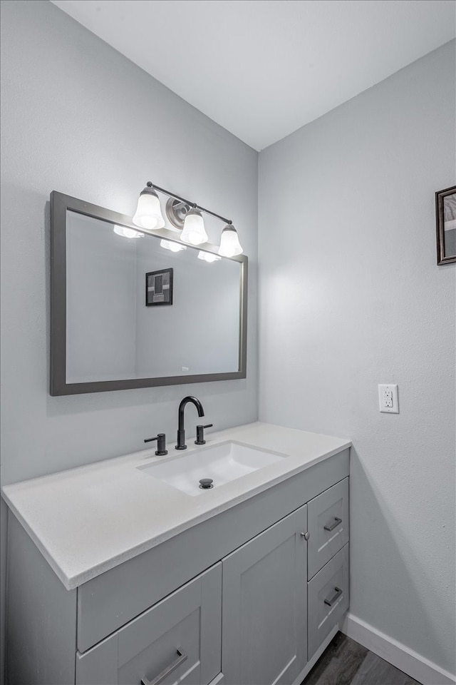 bathroom with wood-type flooring and vanity