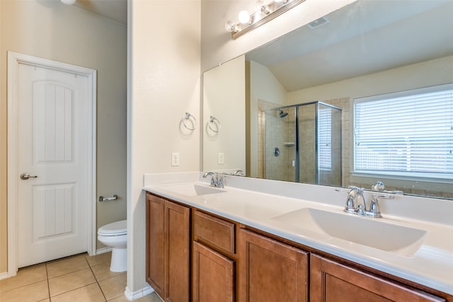 bathroom featuring tile patterned flooring, vaulted ceiling, an enclosed shower, toilet, and vanity