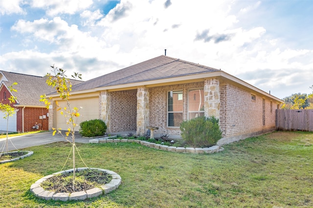 view of front facade with a front lawn and a garage