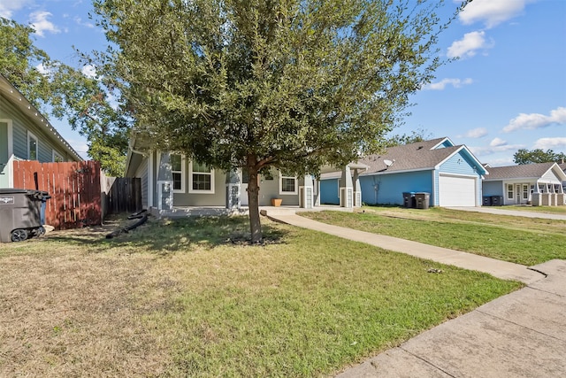 view of front of home with a garage and a front lawn