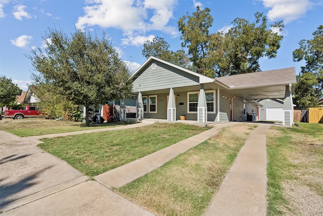 view of front facade featuring a porch, a front yard, and a carport