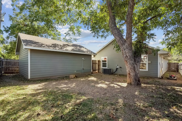 back of property featuring central AC unit