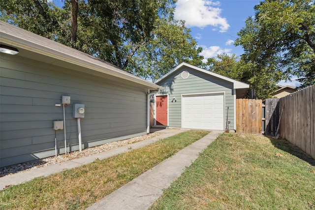 garage featuring a lawn