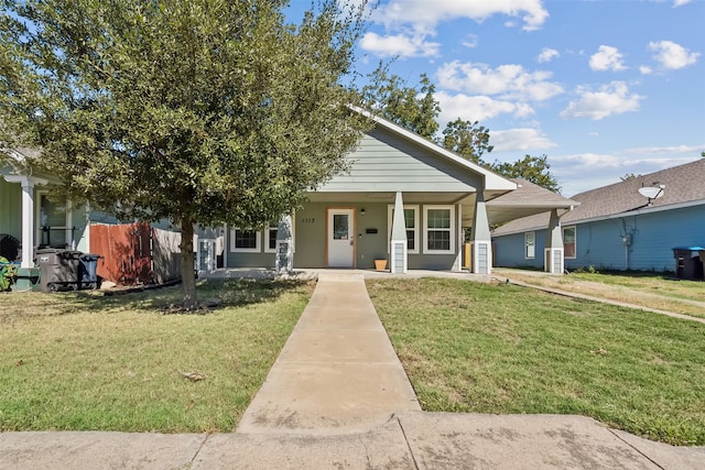 view of front of property featuring a porch and a front lawn