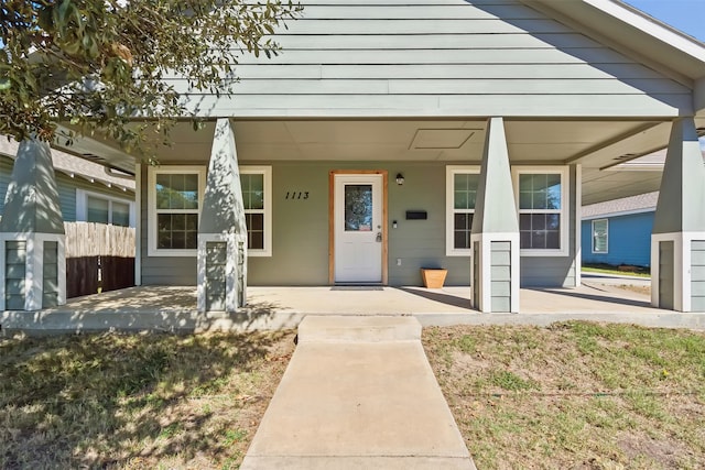 entrance to property featuring a porch