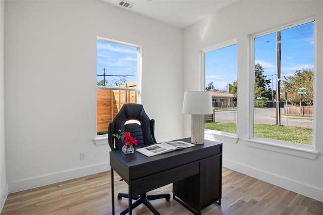 office area featuring plenty of natural light and light hardwood / wood-style floors