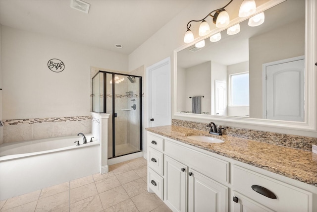 bathroom featuring a garden tub, visible vents, a stall shower, and vanity