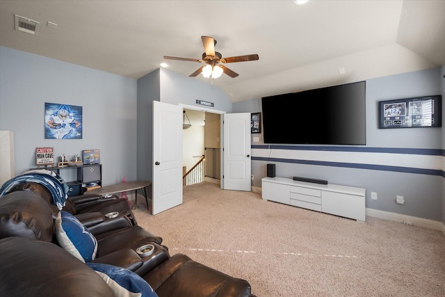 living area featuring vaulted ceiling, carpet floors, a ceiling fan, baseboards, and visible vents